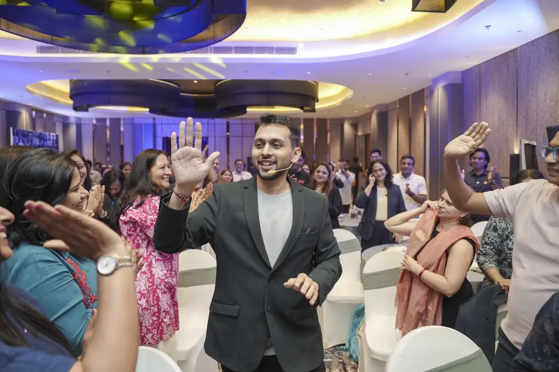 Sagar Sangam Sahu celebrating with coaches from the TBM community at a live event